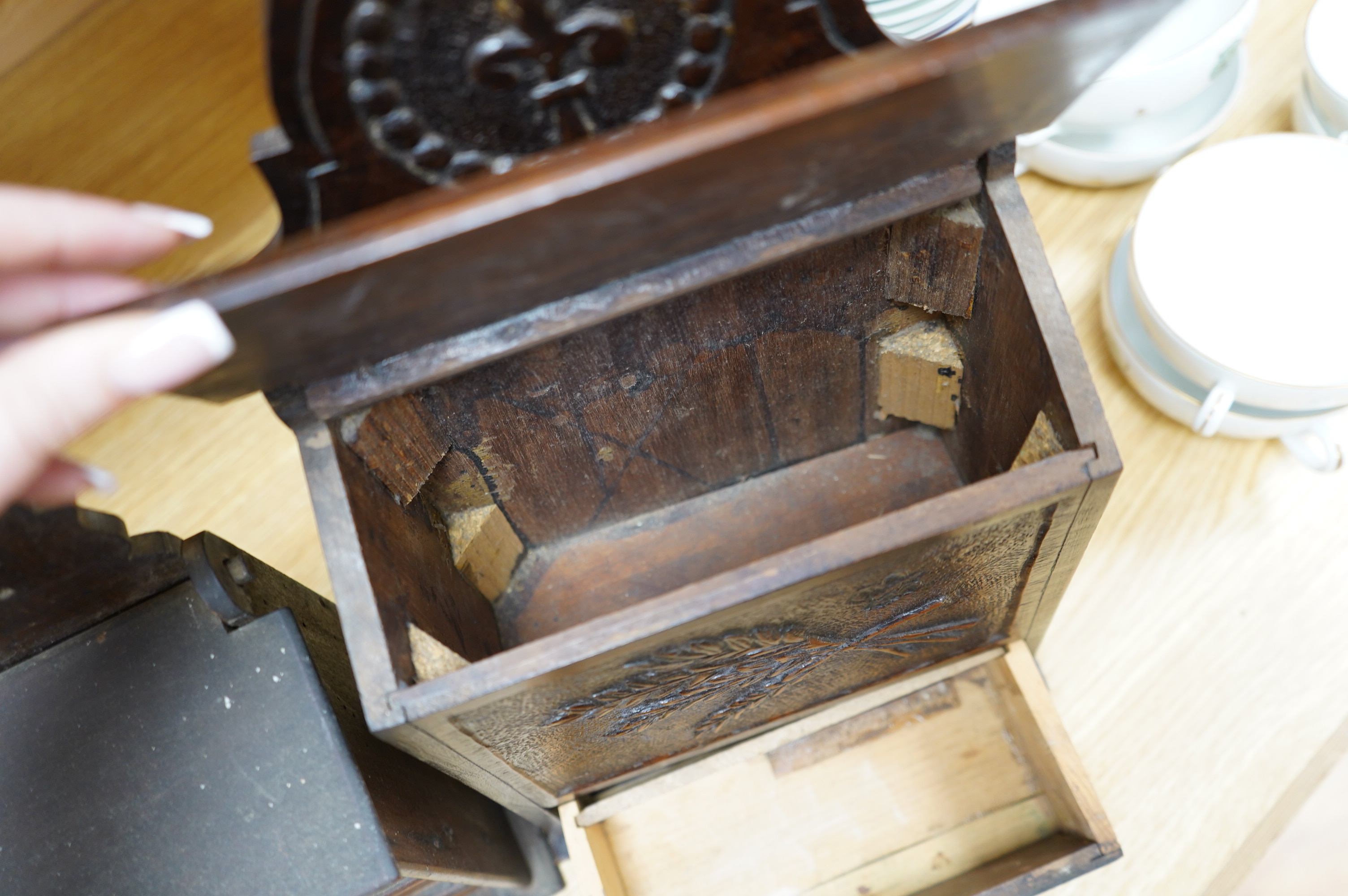 Two 19th century carved beech salt boxes, largest 40cm high. Condition - fair